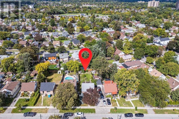 Aerial view showing a red marker on a residential property surrounded by other houses. - 68 Allenby Avenue, Toronto