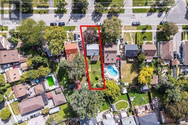 Overhead view of a rectangular property with a house, pool, and trees, outlined in red. - 68 Allenby Avenue, Toronto