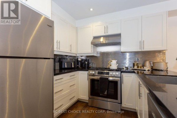 Dining room with a rectangular table, upholstered chairs, a mirrored buffet, and a rug. - 68 Carron Avenue, Vaughan