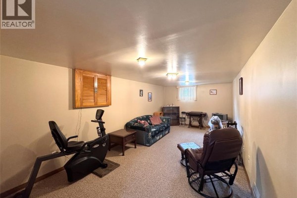 Recumbent exercise bike, sofa, and rocking chair in finished basement - 68 Greenbriar Trail Wallaceburg