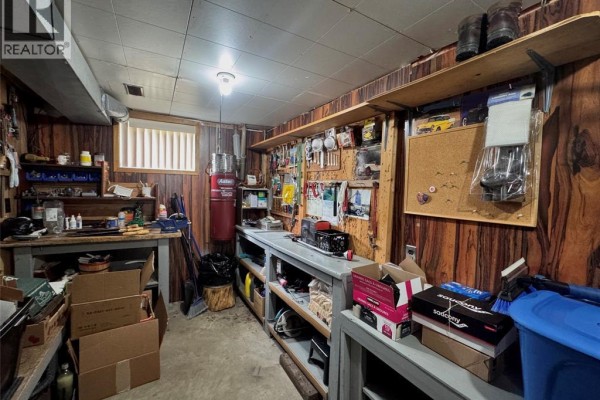 Workshop with workbench, tools, and storage - 68 Greenbriar Trail Wallaceburg