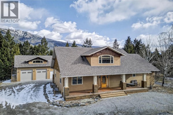Aerial view of residential area with homes and surrounding mountains - 6880 Columbia Ridge Drive, Fairmont Hot Springs