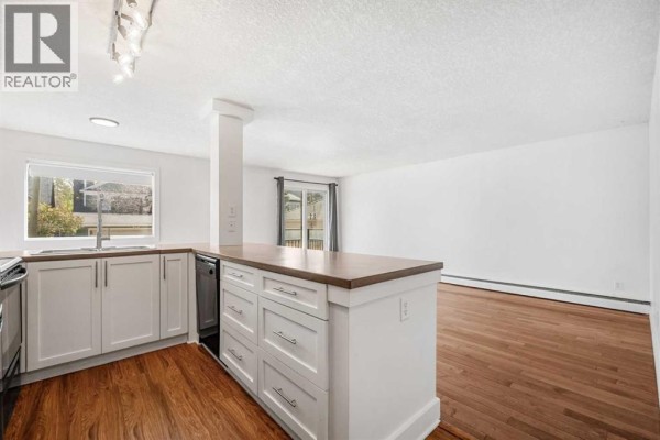 Living room - 7, 2110 15 Street Sw, Calgary, AB T2T3Y8 Photo 5