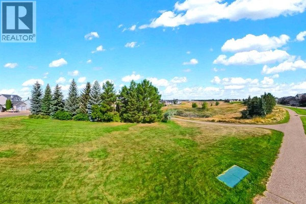 Living room - 7, 89 Sunrise Way Sw, Medicine Hat, AB T1B4X9 Photo 4