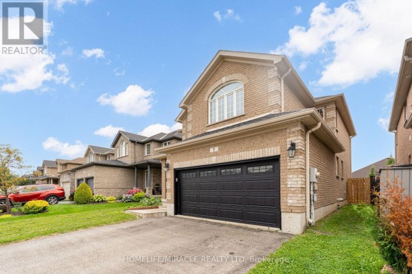 Street view of 7 Empire Drive showing the brick house exterior and neighboring homes. - 7 Empire Drive, Barrie