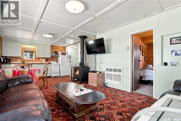 Interior hallway with green walls, wooden ceiling, and a white door at the end. - 7 Mathews Crescent, Turtle View