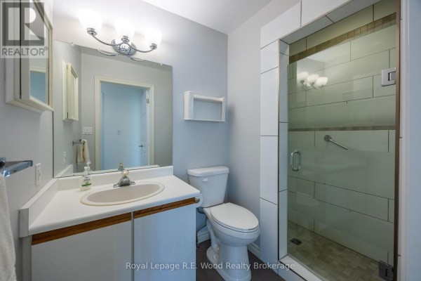 Bathroom with vanity, toilet, and glass shower with subway tiles - 7 Seres Drive Tillsonburg