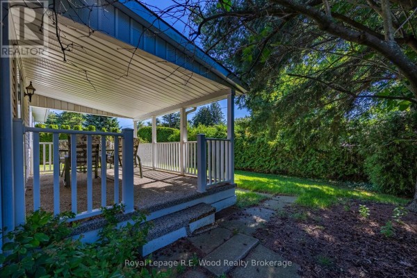 Covered back porch with furniture and yard views - 7 Seres Drive Tillsonburg