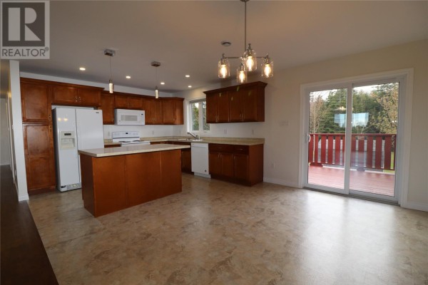 Empty walk-in closet with a wire shelf and dark hardwood floors. - 7 Squires Road, Paradise
