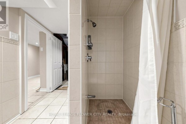 Shower stall with tiled walls and floor, shower curtain - 70 Boom Road Vaughan