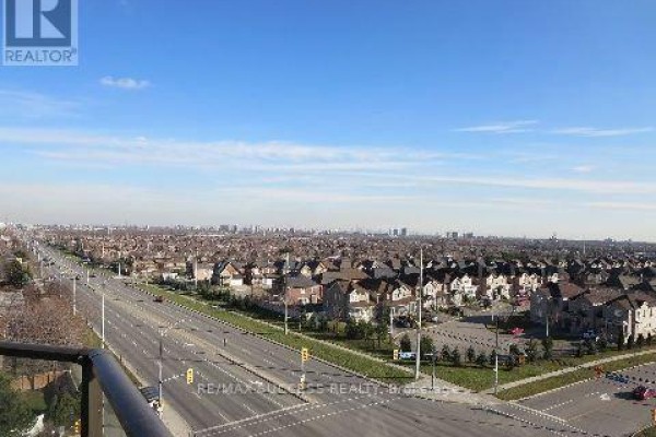 View of suburban houses and streets from a high vantage point on a clear day. - 701 - 220 Forum Drive, Mississauga