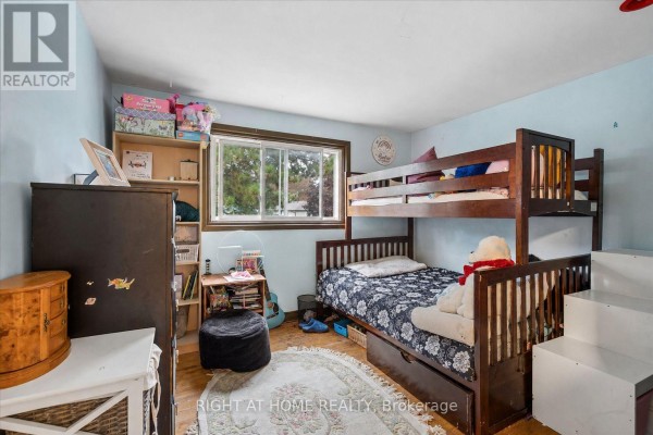 Children's bedroom with bunk bed, dresser, and bookshelf - 701 Central Park Boulevard N Oshawa