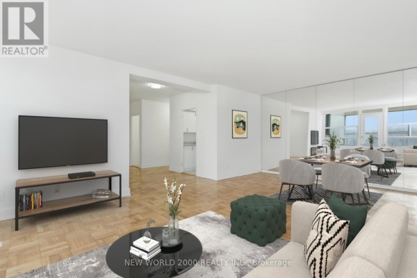 Combined living and dining area with beige sofa, dining table set for four, and balcony access. - 702 - 40 Park Road, Toronto
