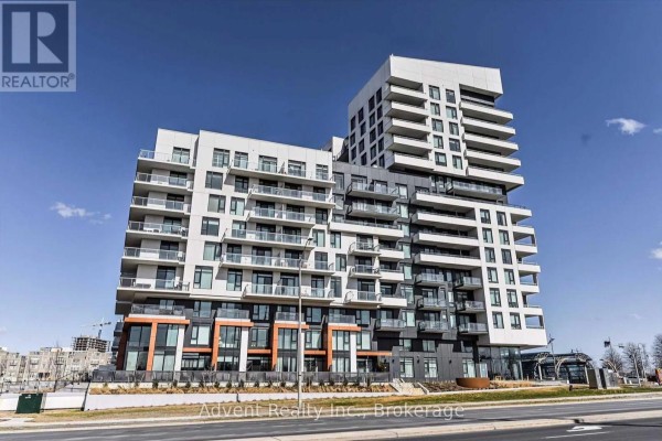 View of the modern condo building exterior with white and grey facade and balconies. - 702 - 8 Rouge Valley Drive W, Markham