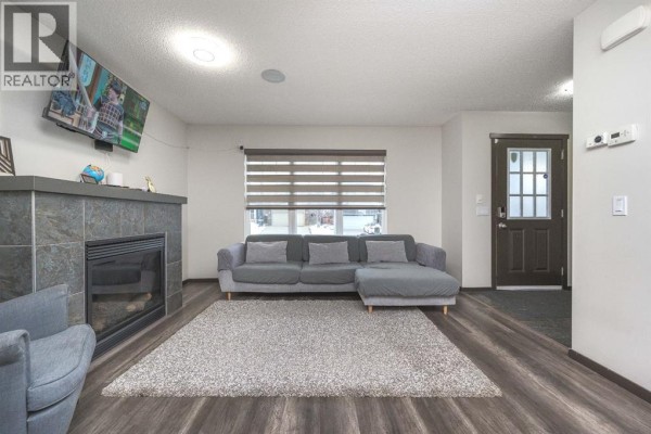 Living room - 702 Panamount Boulevard Nw, Calgary, AB T3K0P7 Photo 4