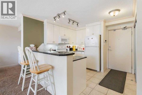 Dining room - 704, 4603 Varsity Drive Nw, Calgary, AB T3A2V7 Photo 3