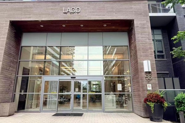 Glass entrance doors with the building name LAGO above. - 704 - 56 Annie Craig Drive, Toronto