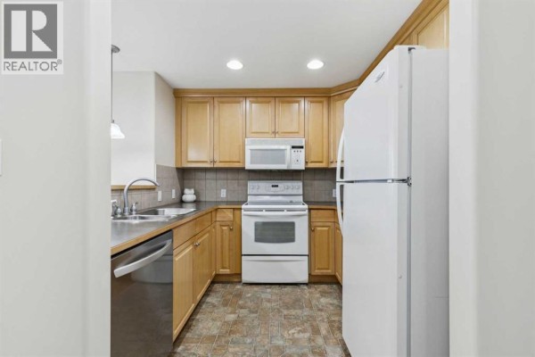 Laundry room - 705, 1726 14 Avenue Nw, Calgary, AB T2N4Y8 Photo 4