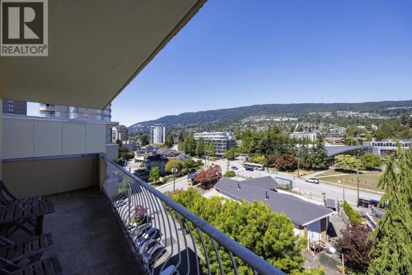 Balcony view from the apartment overlooking the street and distant hills. - 705 2187 Bellevue Avenue, West Vancouver