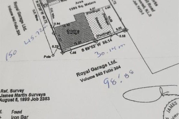 Survey plan showing property boundaries, lot dimensions, and building footprint with handwritten notes. - 705 Topsail Road, Mount Pearl