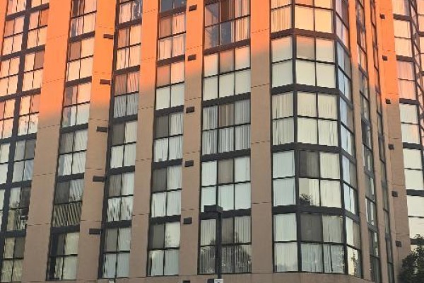 Close-up of the apartment building's facade with multiple large windows - 706 - 600 Rexdale Boulevard, Toronto