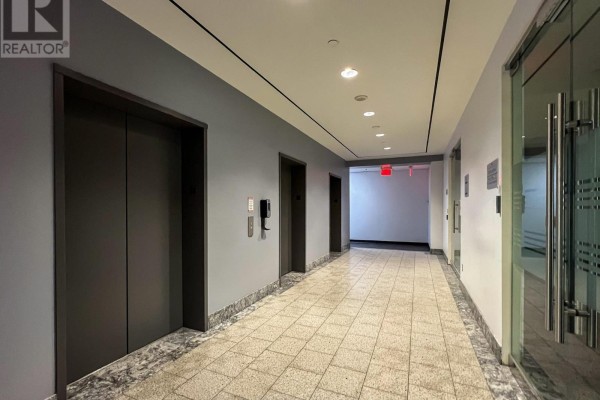 Entrance with revolving door and glass facade at 3601 Highway 7 - 707 - 3601 Highway 7 Highway E, Markham