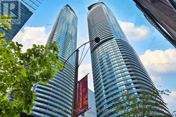 Exterior view of the Aura condo towers at 65 East Esplanade, Toronto. - 708 - 14 York Street, Toronto