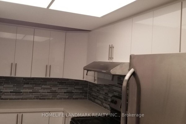 Stainless steel stove, white drawers, and a stainless steel refrigerator in the kitchen. - 708 - 1470 Midland Avenue, Toronto