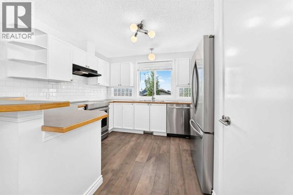 Living room - 708 Tuscany Drive Nw, Calgary, AB T3L3A7 Photo 3