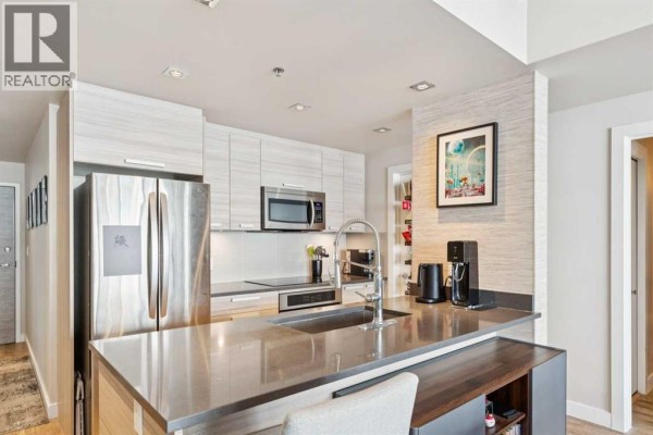 Living room - 709, 235 9a Street Nw, Calgary, AB T2N1T7 Photo 5