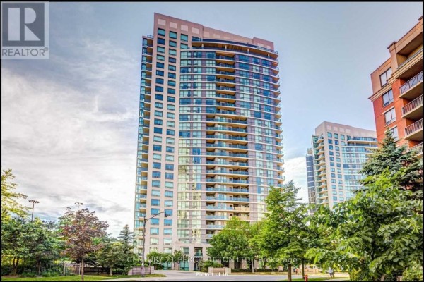 Tall, modern apartment building with balconies against a blue sky. - 709 - 28 Harrison Garden Boulevard, Toronto