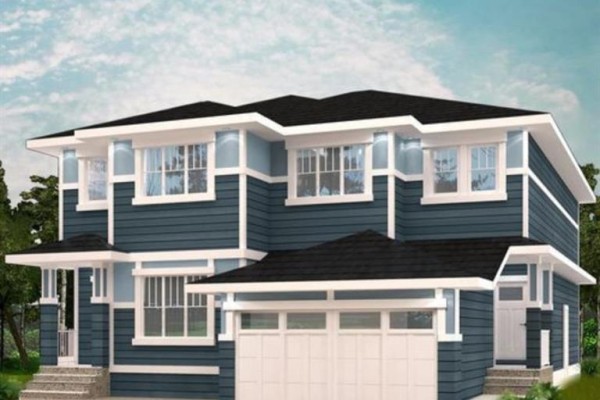 Exterior view of a two-story duplex with blue siding and a double garage - 709 Clearview Green, Chestermere