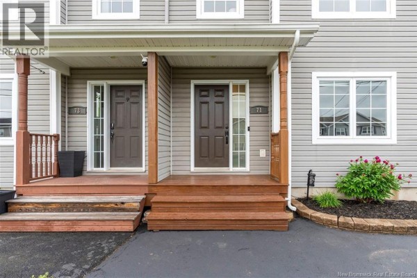 Close-up of two front doors, one labeled 73 and the other 71, with wooden porches and steps. - 71 Houlahan Street, Dieppe