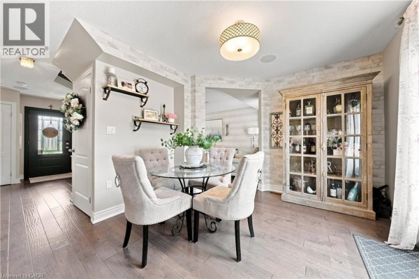 Glass dining table with upholstered chairs and display cabinet - 71 Riviera Ridge Stoney Creek