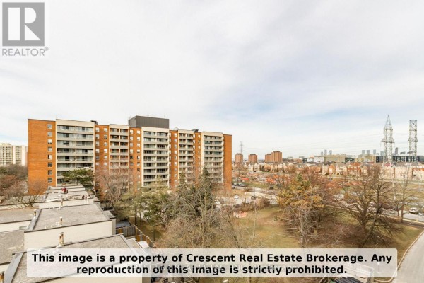 View of apartment buildings and surrounding cityscape from a high floor. - 710 - 9 Four Winds Drive Sw, Toronto