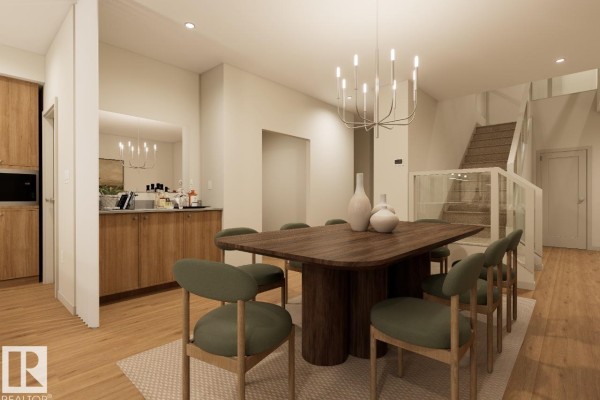 Dining room with a large wooden table, green chairs, and a built-in bar cabinet. - 7107 50a Av, Beaumont