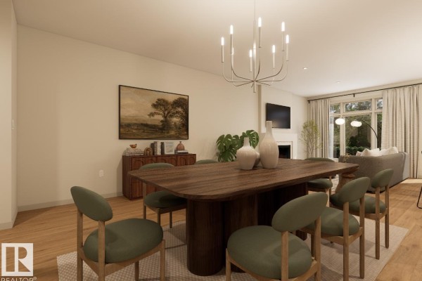 Dining area with a wooden table, green chairs, and a fireplace and living room visible. - 7107 50a Av, Beaumont
