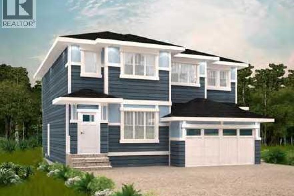 Exterior view of a two-story duplex with blue siding and a double garage - 713 Clearview Green, Chestermere