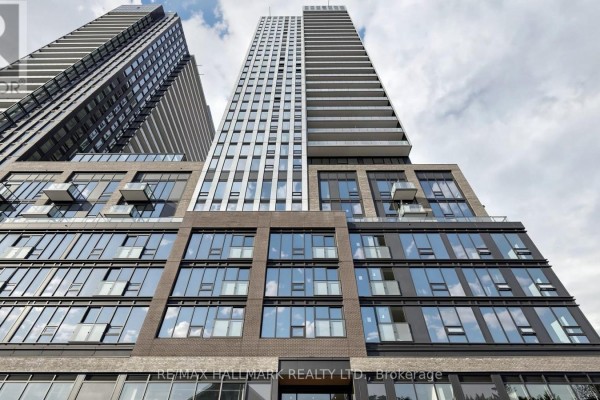 Low-angle view of modern apartment towers with glass and metal facade. - 719 - 101 John Street N, Hamilton