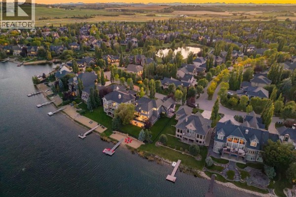 Aerial view of a lakeside community with multiple homes and water access. - 72 Heritage Lake Shores, Heritage Pointe