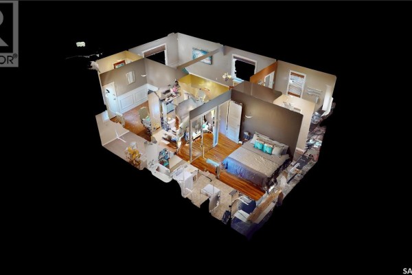 3D floor plan showing multiple rooms, including a bedroom with a blue bedspread. - 723 9th Street E, Saskatoon