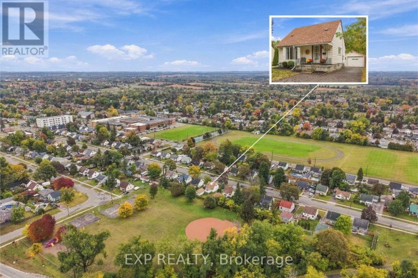 Aerial view of a residential neighborhood with a house highlighted and an inset photo of the property. - 724 Mckellar Street, Peterborough
