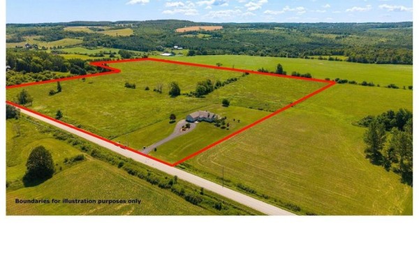 Aerial drone view of a house on a large property outlined in red. - 728454 21st Side Road, Blue Mountains