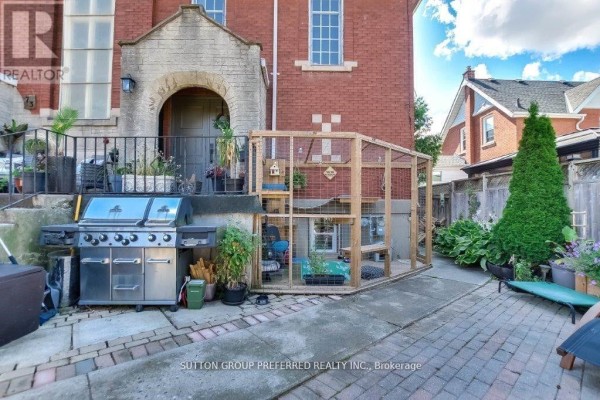 Side yard view of the house with a grill and large outdoor cat enclosure. - 73 Fifth Avenue, St  Thomas