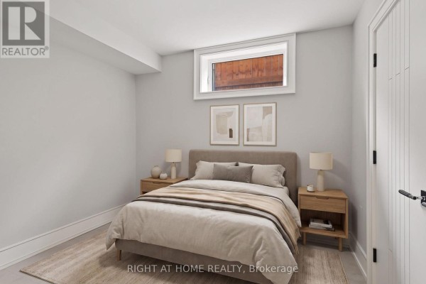 Bedroom with king bed, wooden nightstands, and modern art - 73 Harding Boulevard Richmond Hill