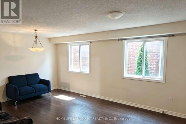 Bedroom with a queen bed, wooden headboard, and dark grey curtains. - 740 Oakcrossing Road, London North