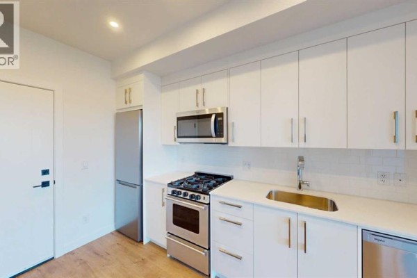 Living room - 743, 110 18a Street Nw, Calgary, AB T2N5G5 Photo 3