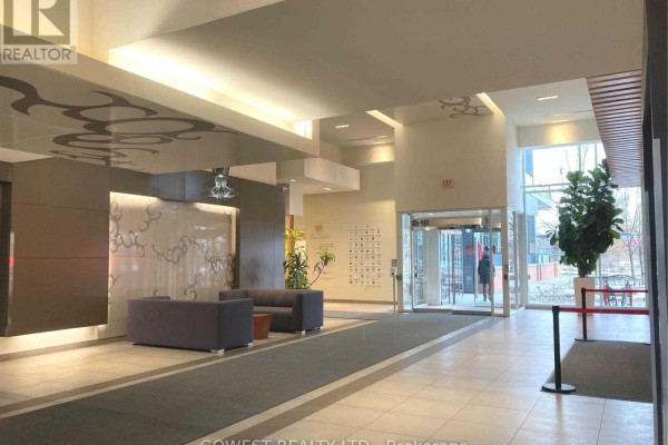 Wide view of the building lobby with seating area and entrance. - 743 - 5 Hanna Avenue, Toronto