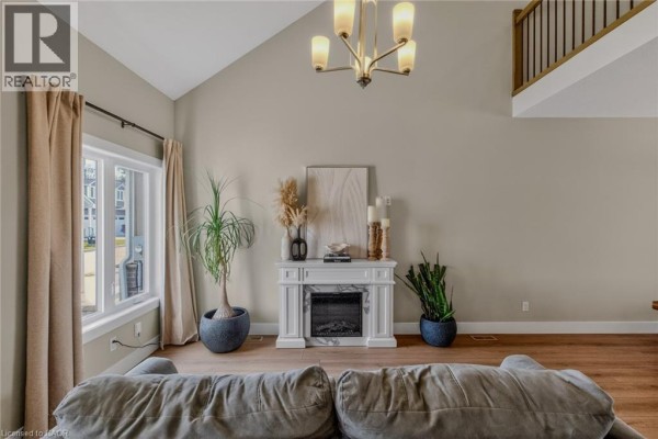 Floor plan layout of the townhouse, showing three levels and room dimensions. - 744 Nelson Street Unit# 5, Port Dover