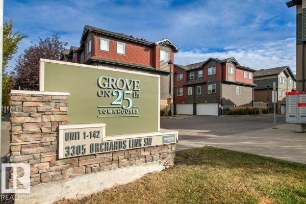 Community sign for "Grove on 25th Townhouses" at the entrance of the development. - #75 3305 Orchards Link Li Sw, Edmonton